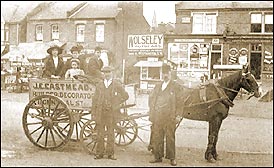 A City Scene - Decorator's cart with a horse and people